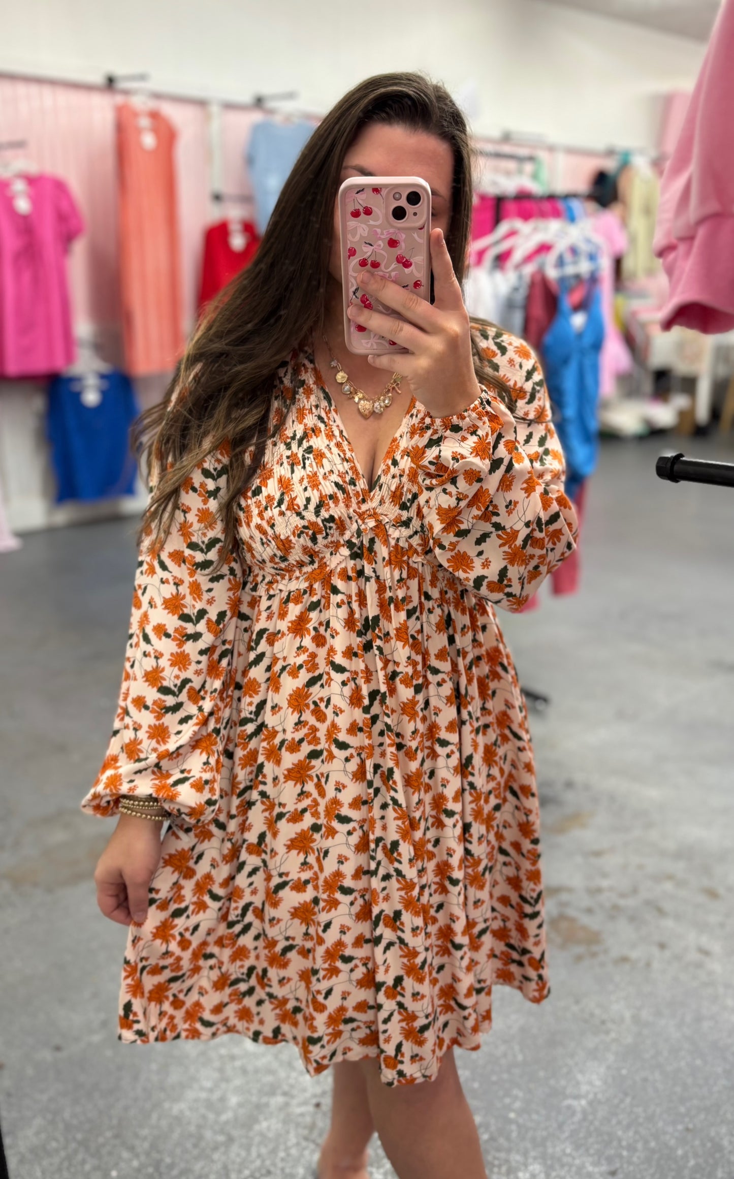 Modern Grace fall floral babydoll dress with V-neck, smocked bust, long sleeves, and a flowy skirt, perfect for autumn wear.