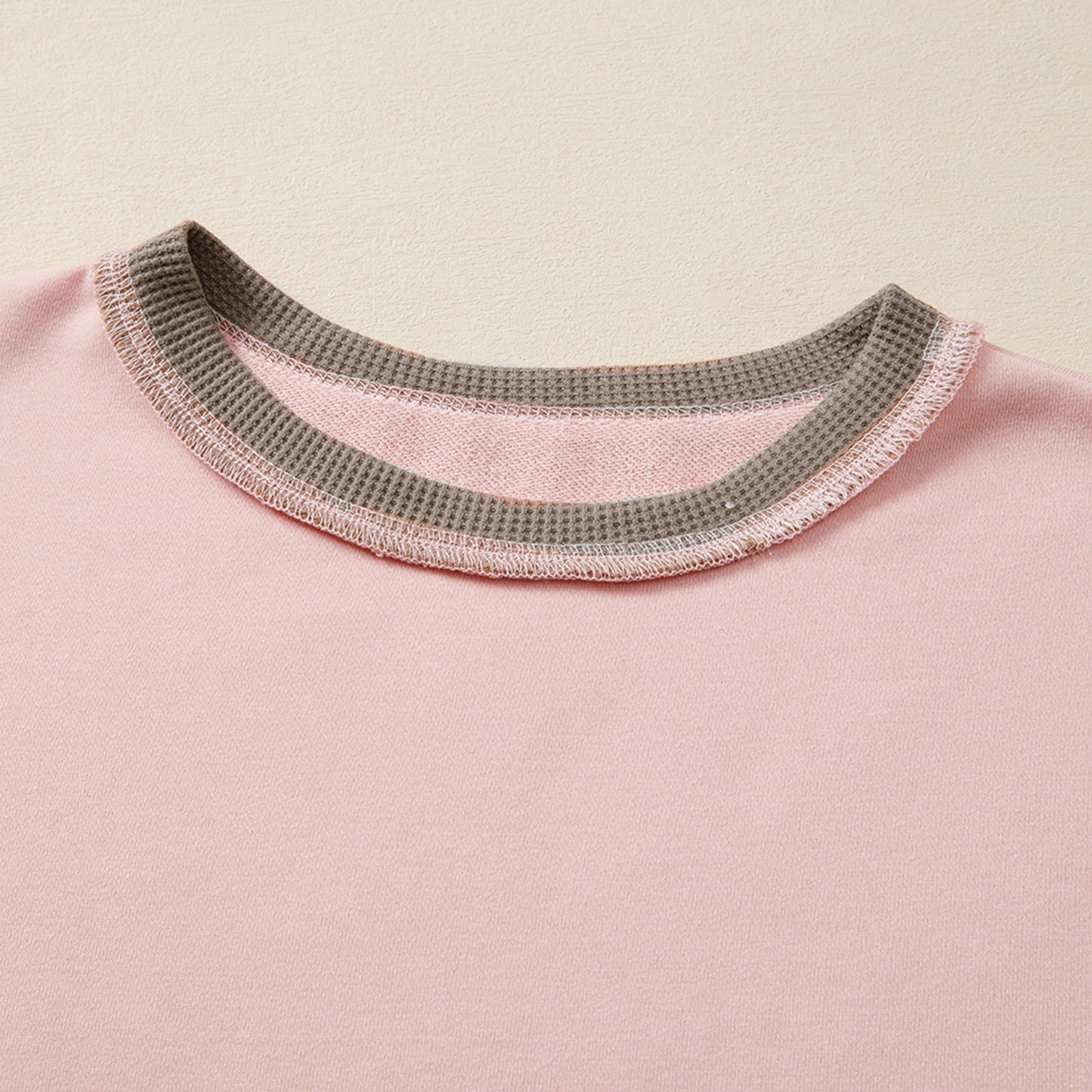 Light pink Modern Grace oversized sweatshirt with color block and waffle patchwork texture, casual and cozy for everyday wear.
