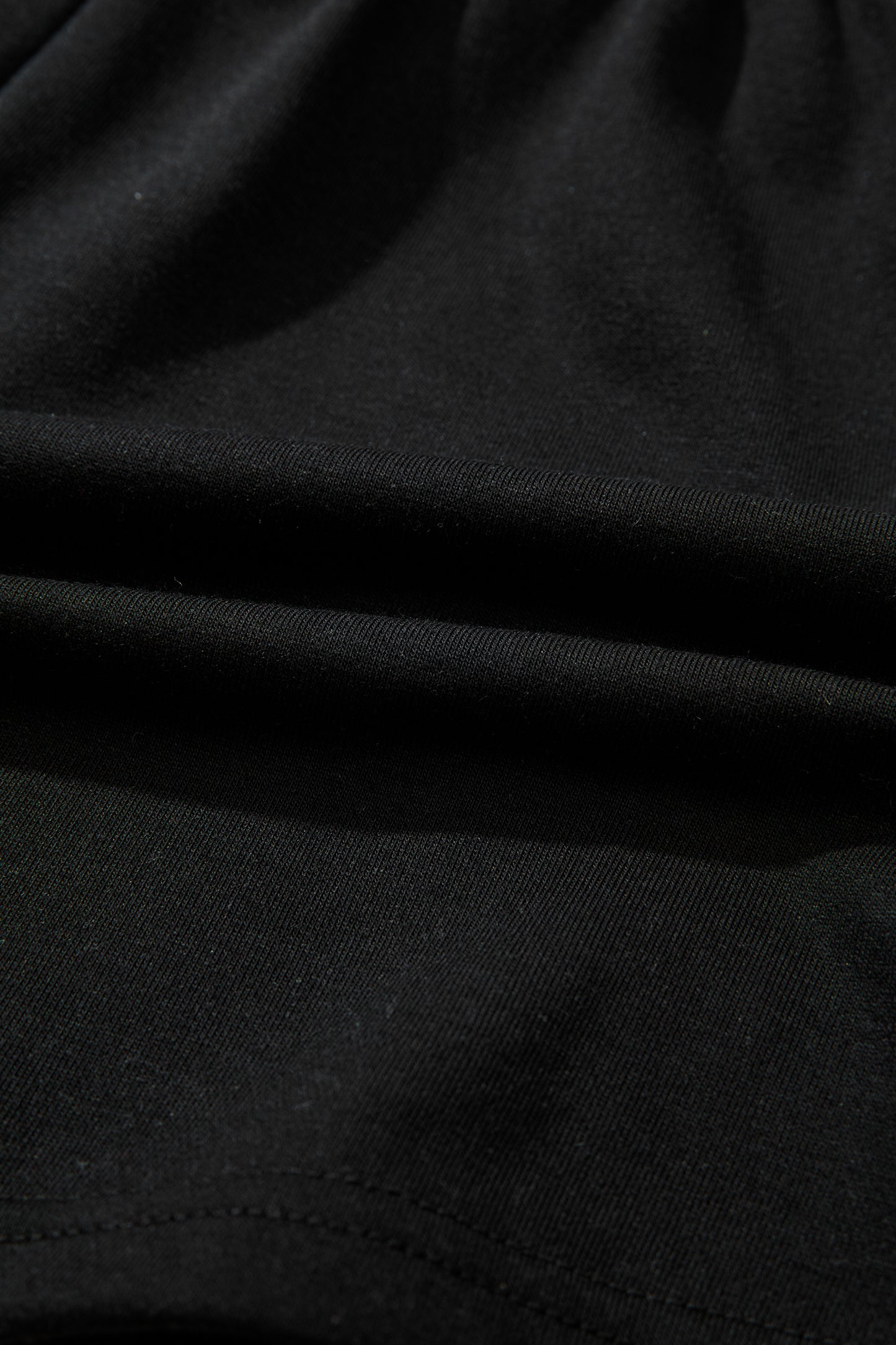 Black leopard print V-neck loose tee and drawstring shorts set by Modern Grace, two-piece casual loungewear.