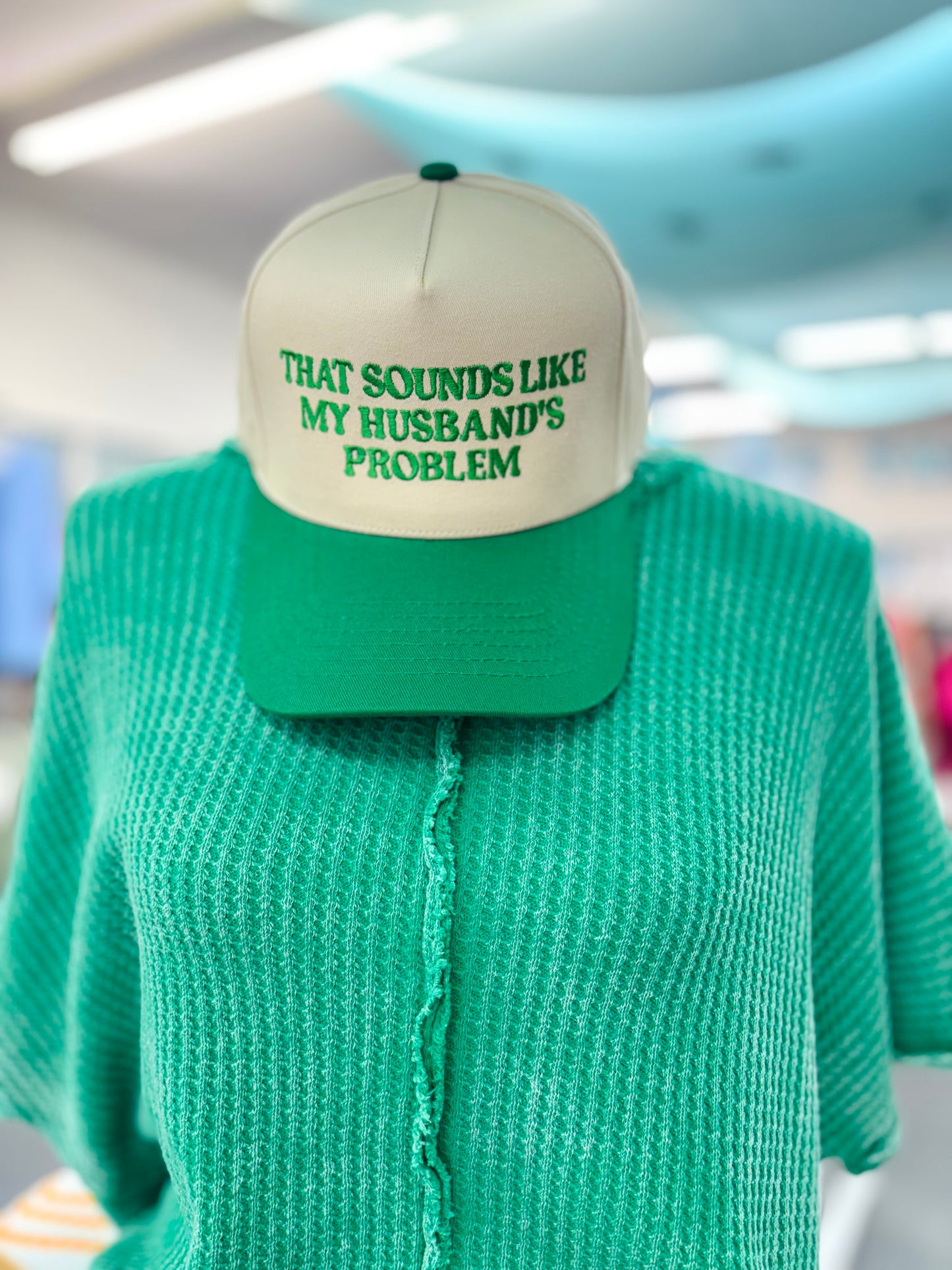 "That Sounds Like My Husband's Problem" Embroidered Two-Tone Trucker Hat