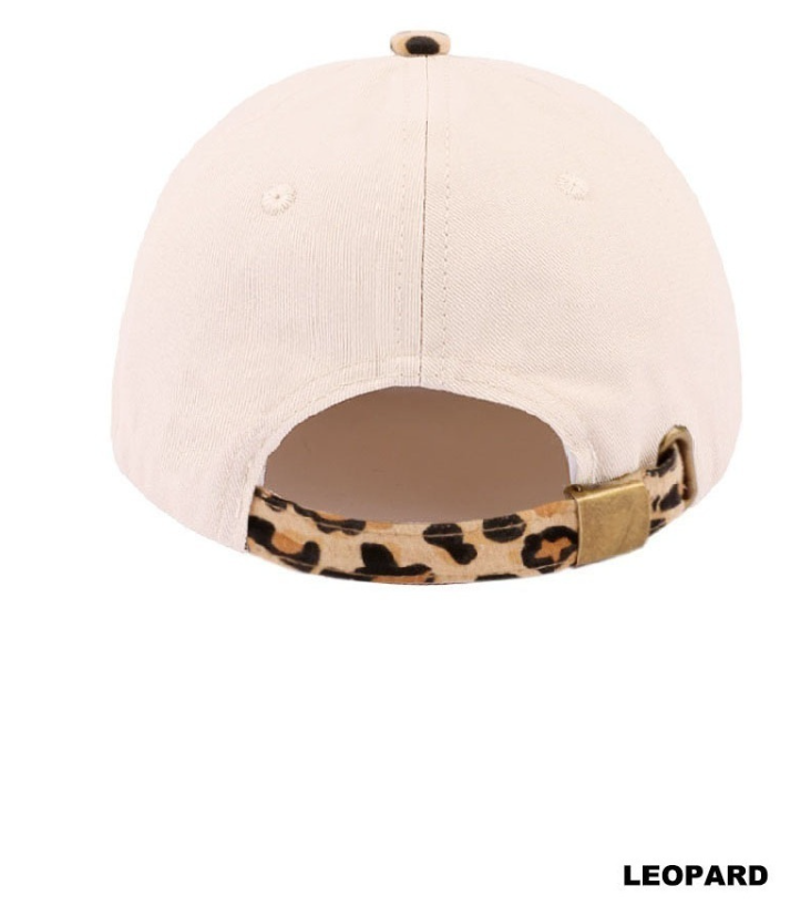 Modern Grace leopard and tan two-tone canvas cotton hat with tipsy brim, casual and stylish headwear.