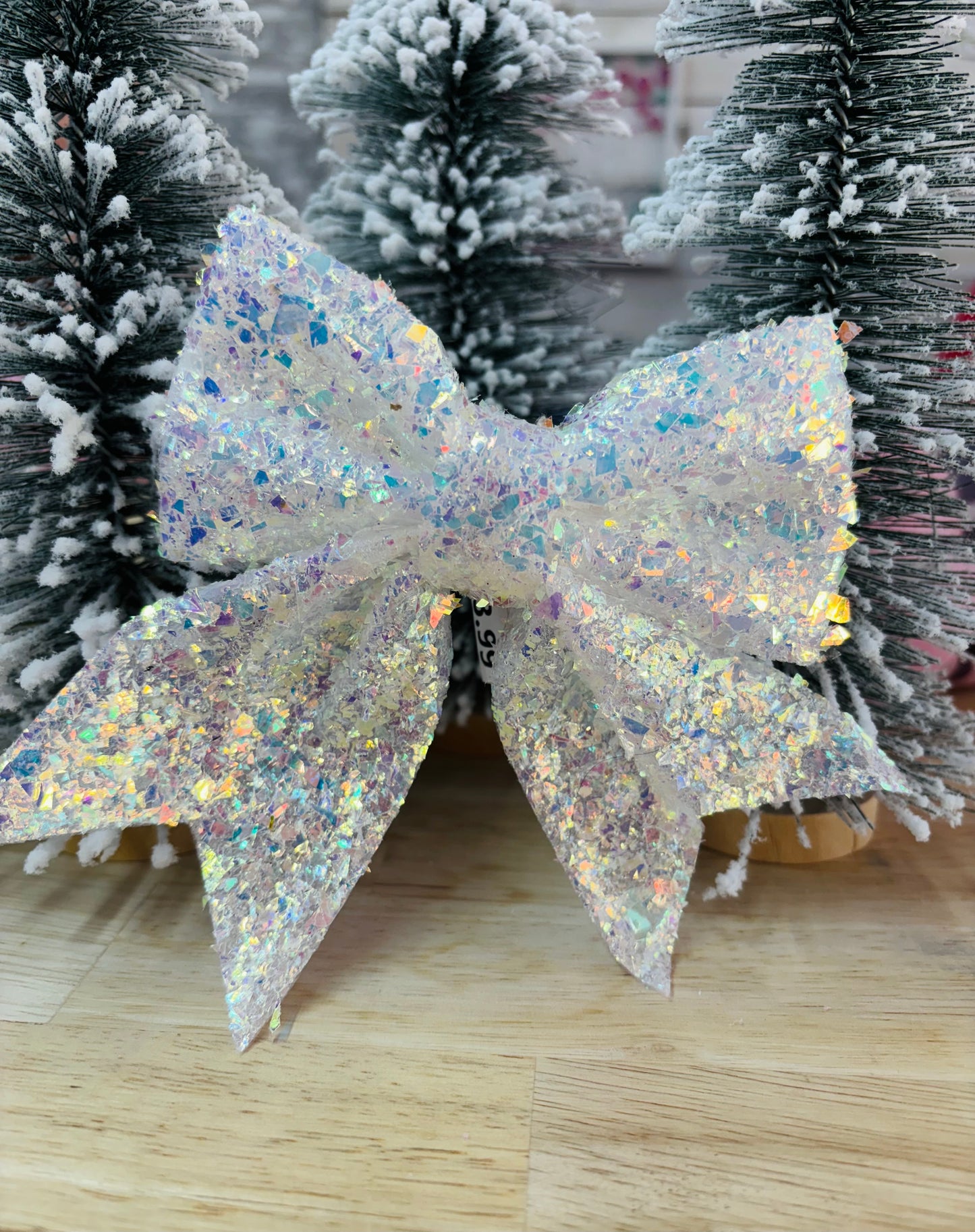 Iridescent Christmas tree bow by Modern Grace, featuring shimmering, colorful ribbon for festive holiday decorating.