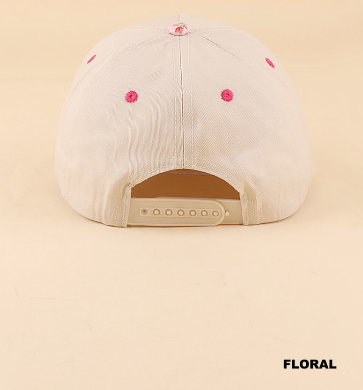 Modern Grace floral two-tone snapback hat with "Cool Mom's Club" embroidered design, featuring vibrant floral accents.