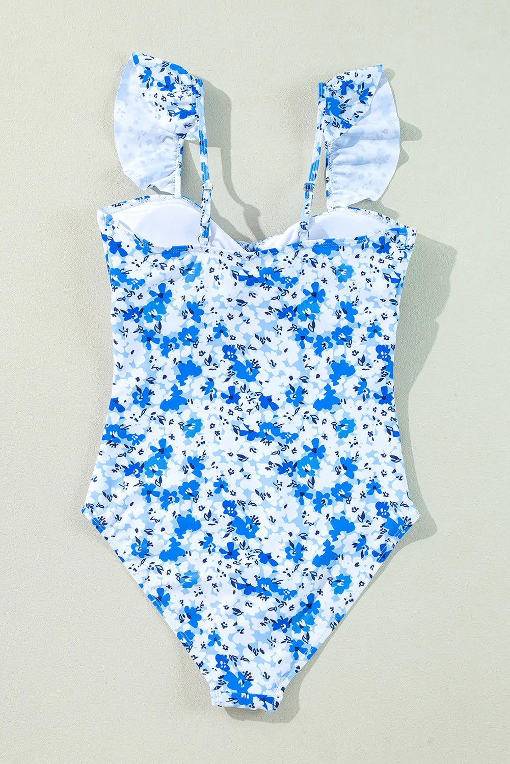 Blue floral lace-up hollow-out one-piece swimsuit by Modern Grace featuring a stylish design and cut-out details.