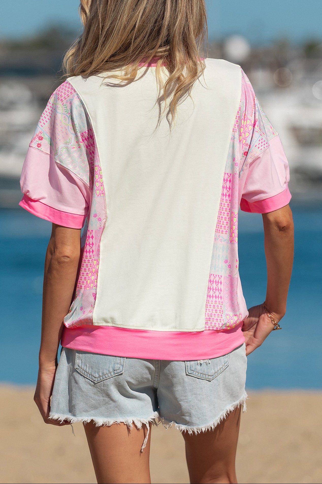 Beige color block floral patchwork relaxed top by Modern Grace featuring a big flower accent, made of polyester, cotton, and elastane.