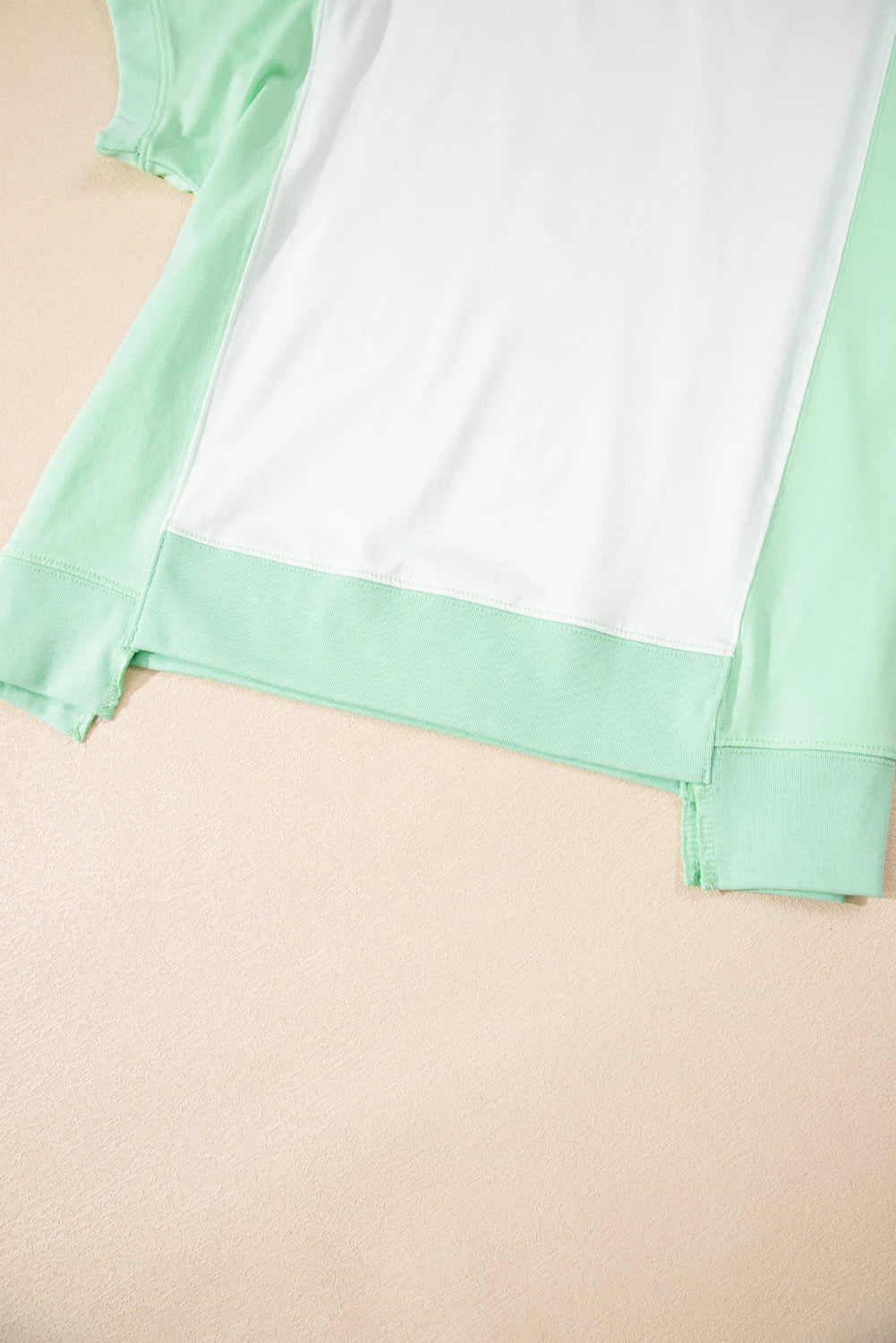 Light green color block crew neck T-shirt by Modern Grace with exposed seams and casual style.