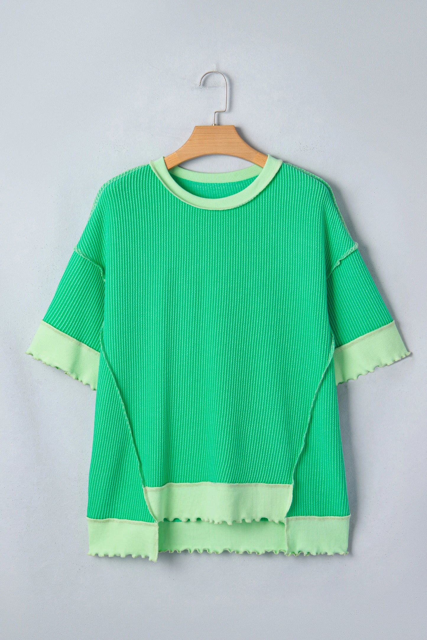 Mint green twisted rib knit tee with drop shoulder design and uneven hem from Modern Grace, showcasing a stylish casual top.