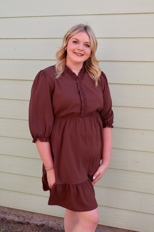 Curvy brown textured dress with frilled trim, V-neck, and puff sleeves by Modern Grace, displayed on a mannequin.