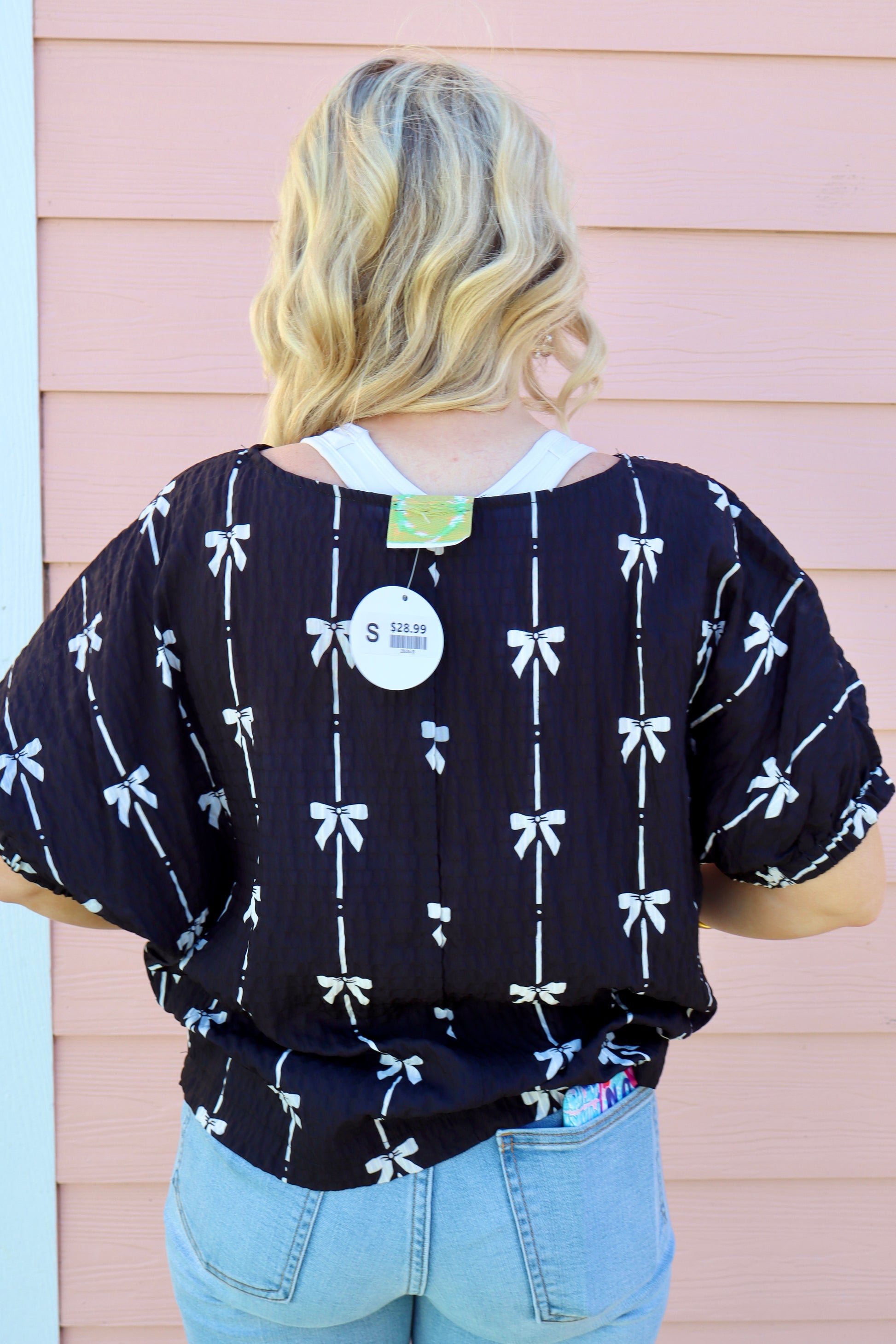 Black puff short sleeve top with bow print from Modern Grace, featuring a feminine design and lightweight fabric.