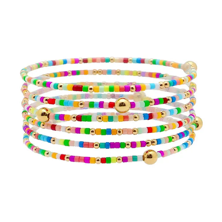 Set of 6 multi seed bead and gold stretch bracelets from What's Hot, featuring colorful beads and gold accents for stylish jewelry.