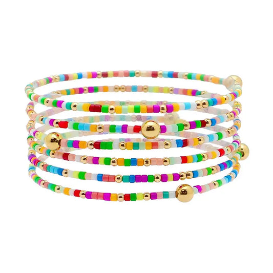 Set of 6 multi seed bead and gold stretch bracelets from What's Hot, featuring colorful beads and gold accents for stylish jewelry.