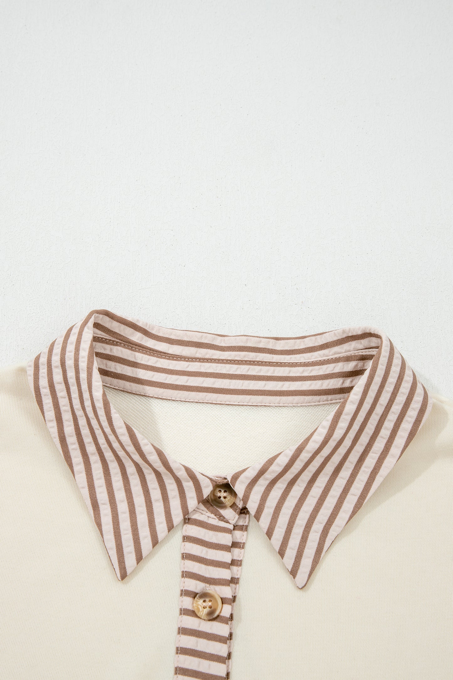 Plus size khaki stripe patchwork peplum blouse by Modern Grace featuring long sleeves and a half-button front.