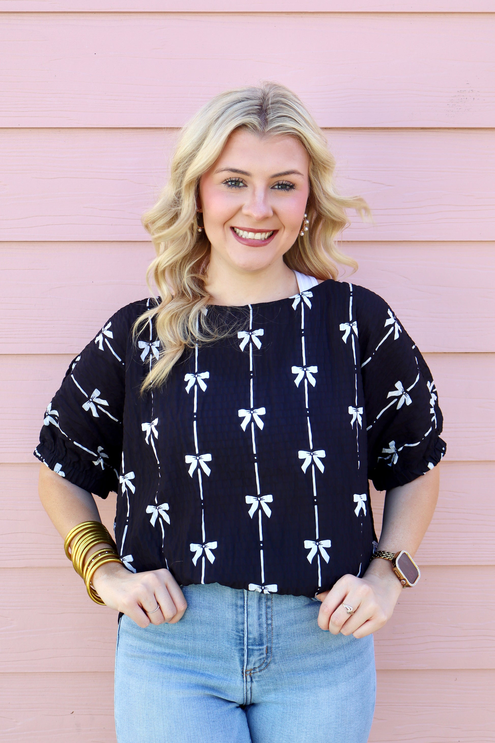 Black puff sleeve top with bow print from Modern Grace, featuring short sleeves and a stylish, feminine design.