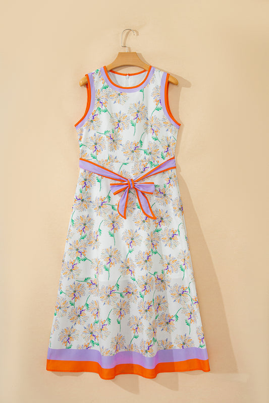 White floral print belted sleeveless maxi dress by Modern Grace, featuring a flowy design and elegant waist tie.