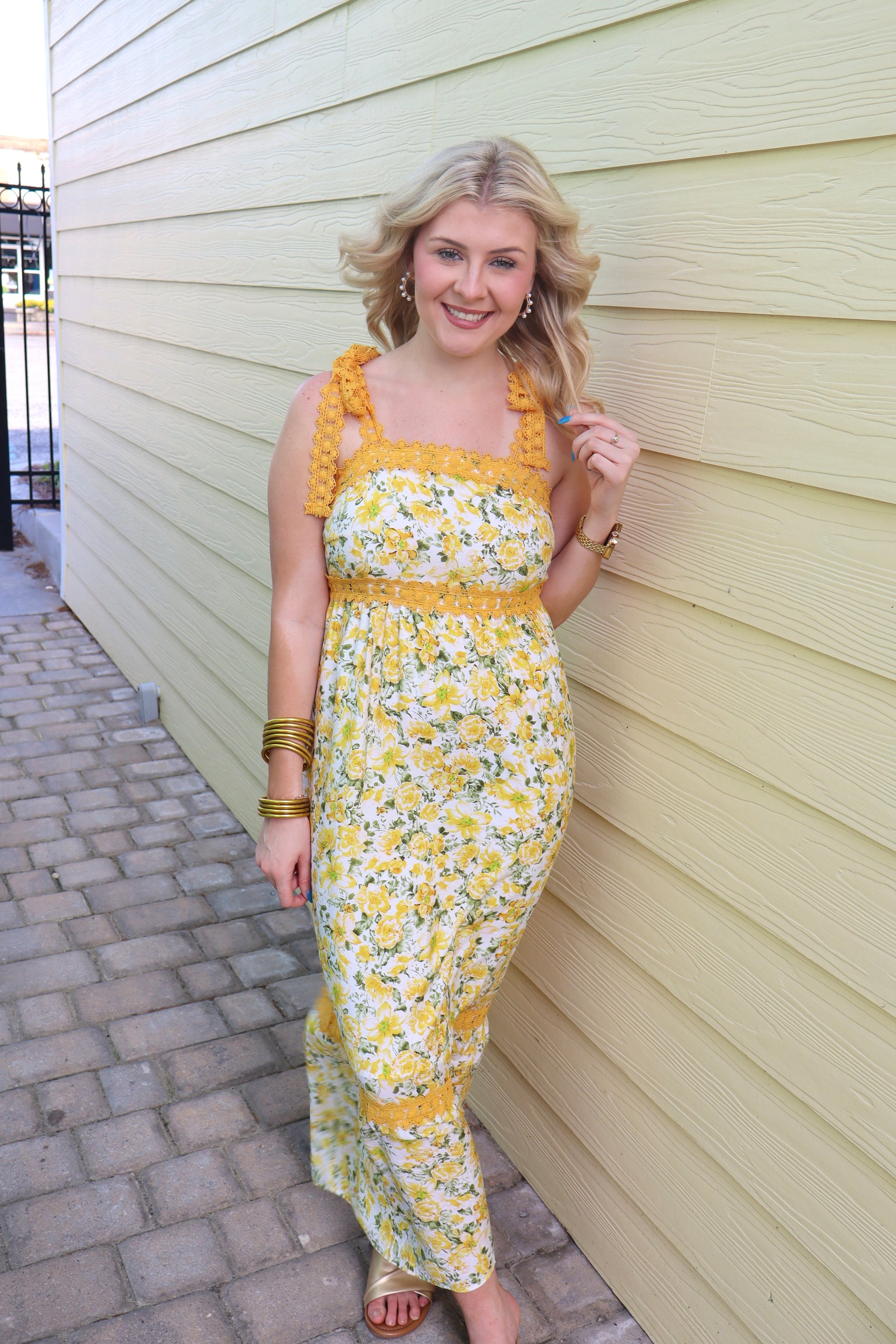 Modern Grace banana cream floral lace maxi dress with tied straps and empire waist, perfect for elegant summer occasions.