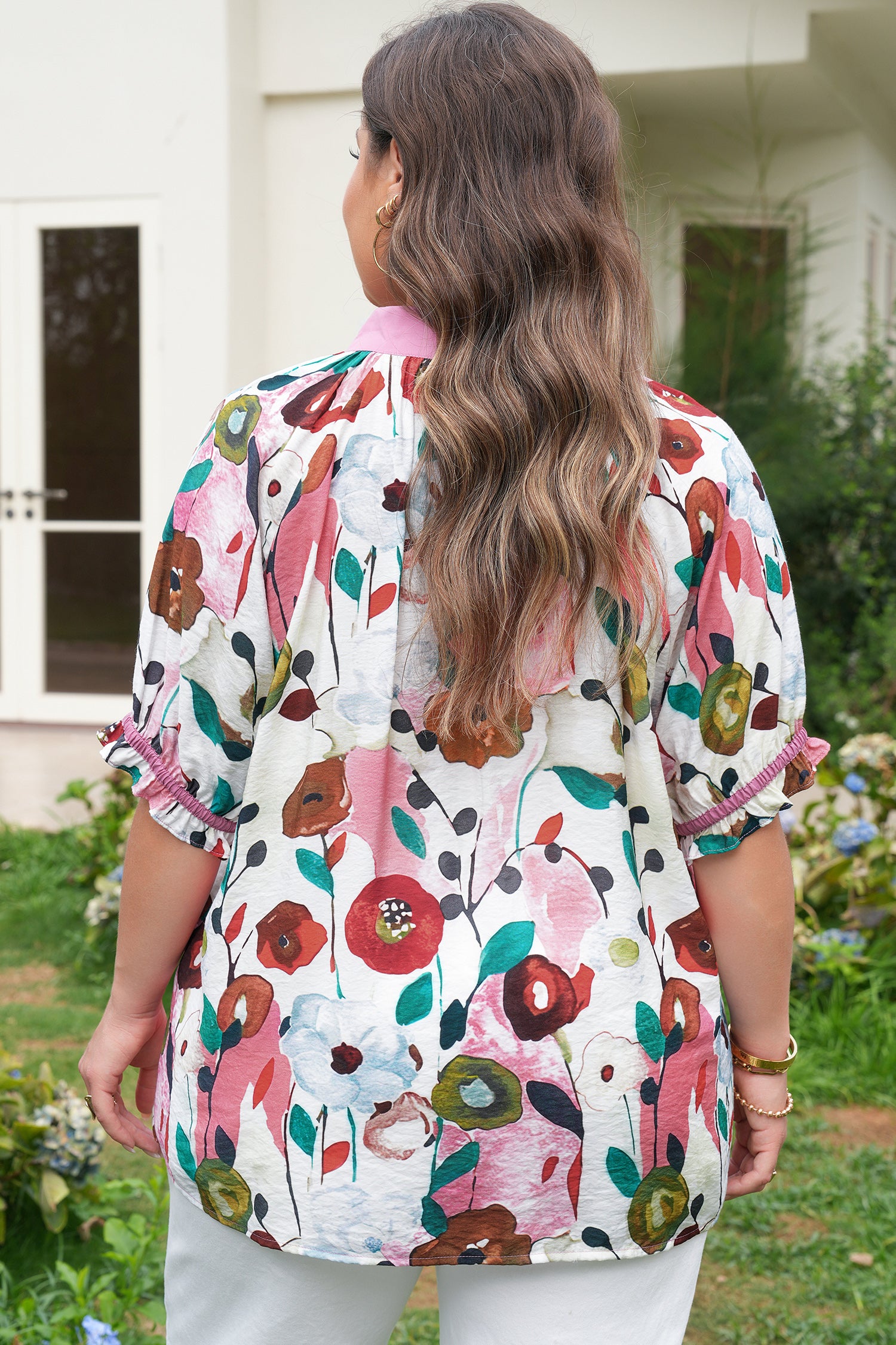 Pink V-neck plus size floral blouse with short puff sleeves by Modern Grace, featuring a flattering fit and vibrant floral pattern.