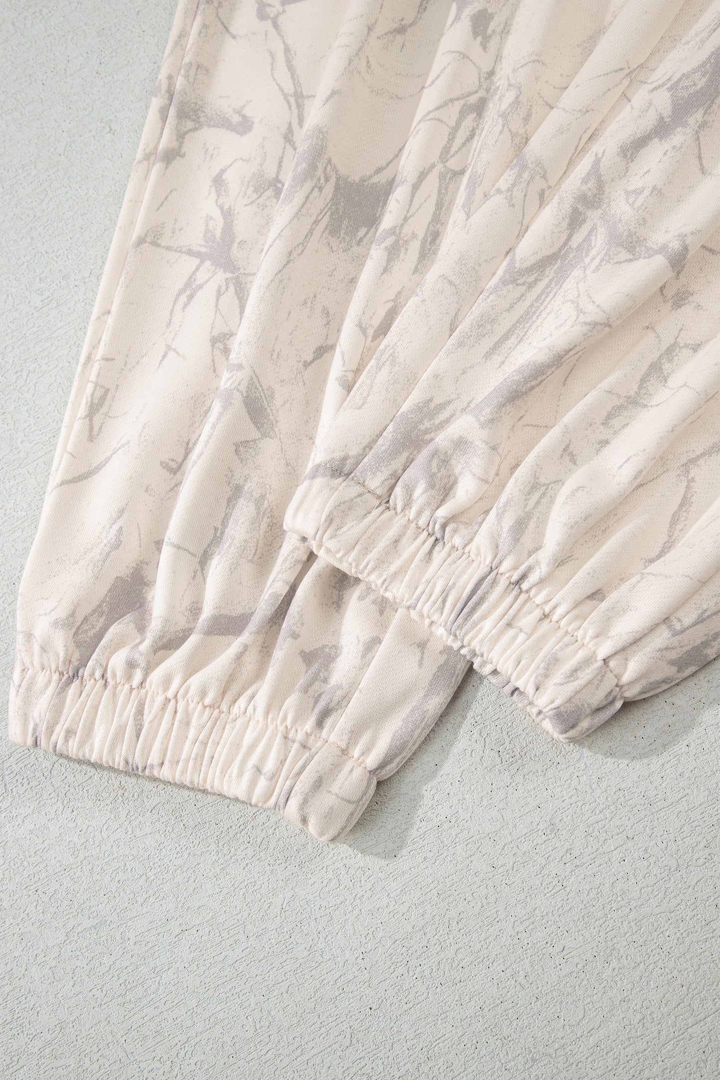 Modern Grace khaki camo print jogger pants set, two-piece casual outfit with relaxed fit, perfect for outdoor or everyday wear.