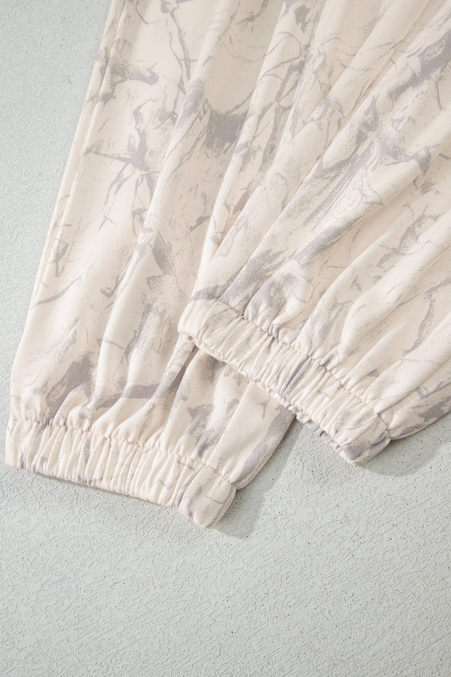 Modern Grace khaki camo print jogger pants set, two-piece casual outfit with relaxed fit, perfect for outdoor or everyday wear.