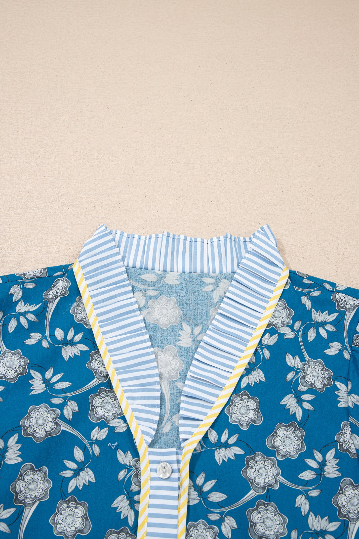 Blue striped floral dress by Modern Grace featuring half buttons, short sleeves, and a floral pattern.