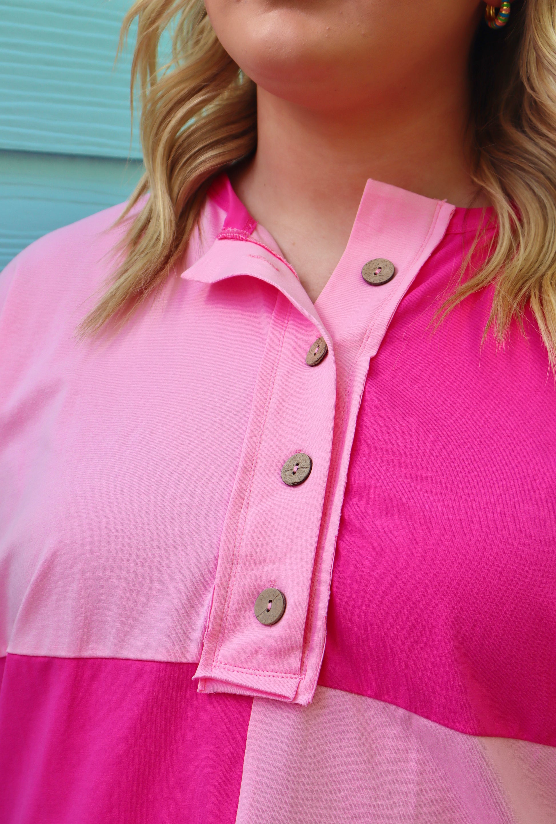 Plus size bright pink colorblock patchwork henley top with short sleeves and button details by Modern Grace.