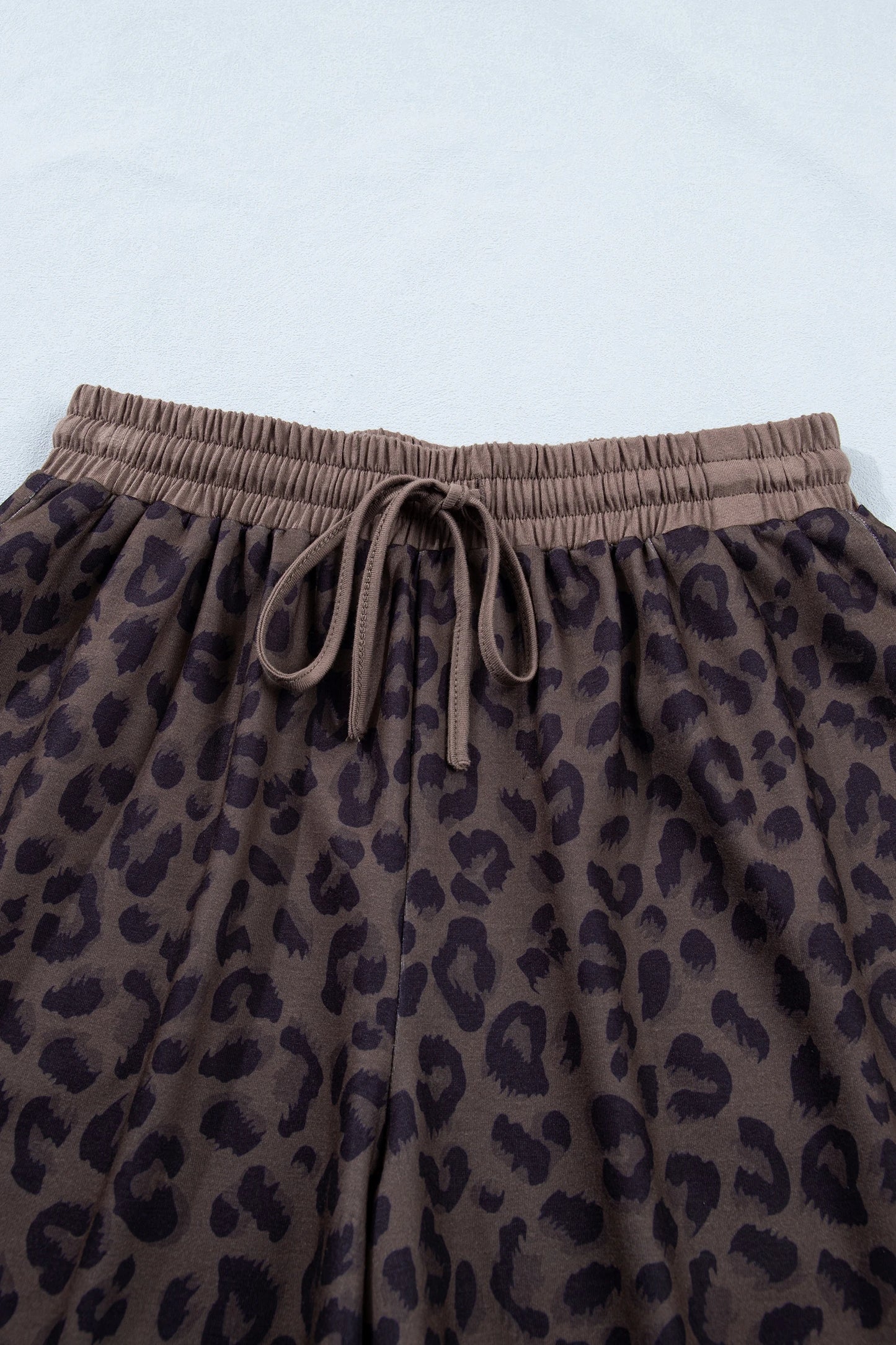Brown leopard print V-neck high waist two-piece short set by Modern Grace, featuring stylish matching top and shorts.