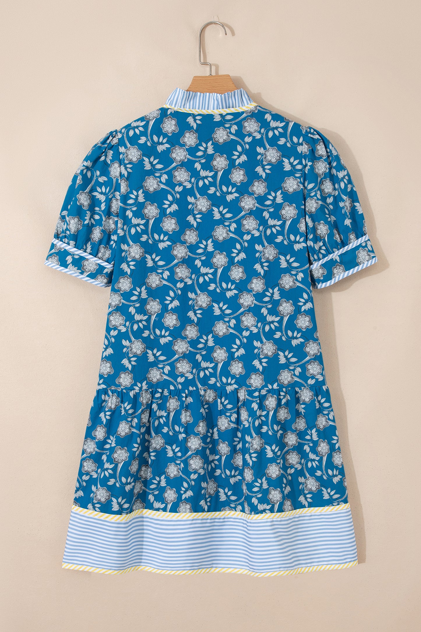 Blue striped floral dress by Modern Grace with half buttons, short sleeves, and trim details, perfect for casual or summer wear.