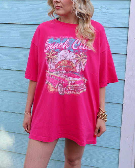 Hot pink vintage oversized graphic top by Modern Grace, featuring bold beach club design on a casual graphic tee.