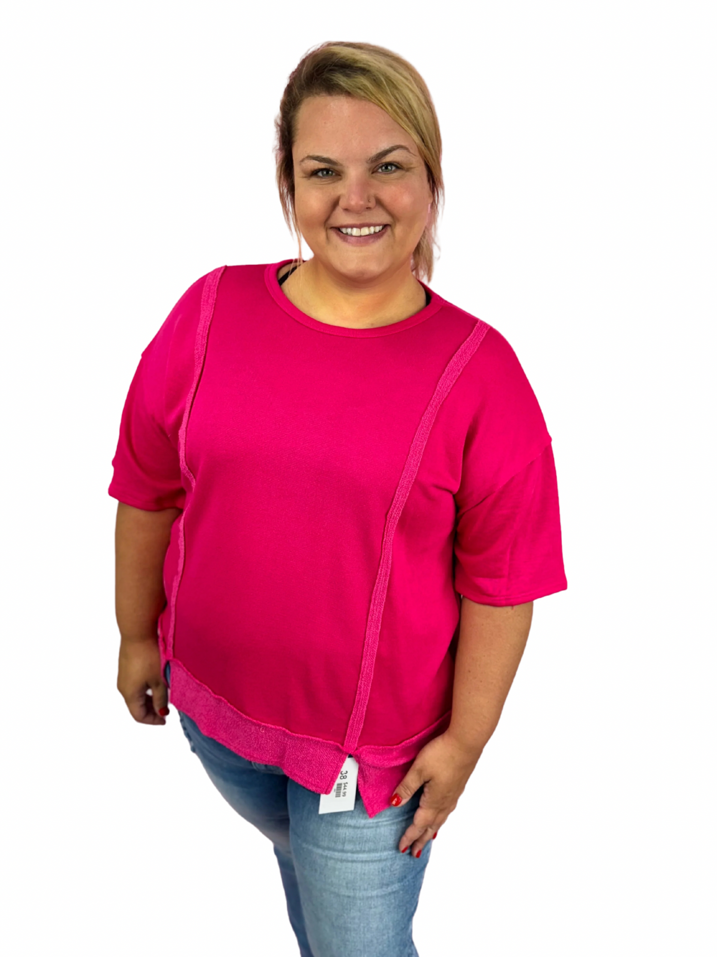 Modern Grace curvy fuchsia solid short sleeve relaxed fit top displayed on a mannequin, showcasing its casual, comfortable style.