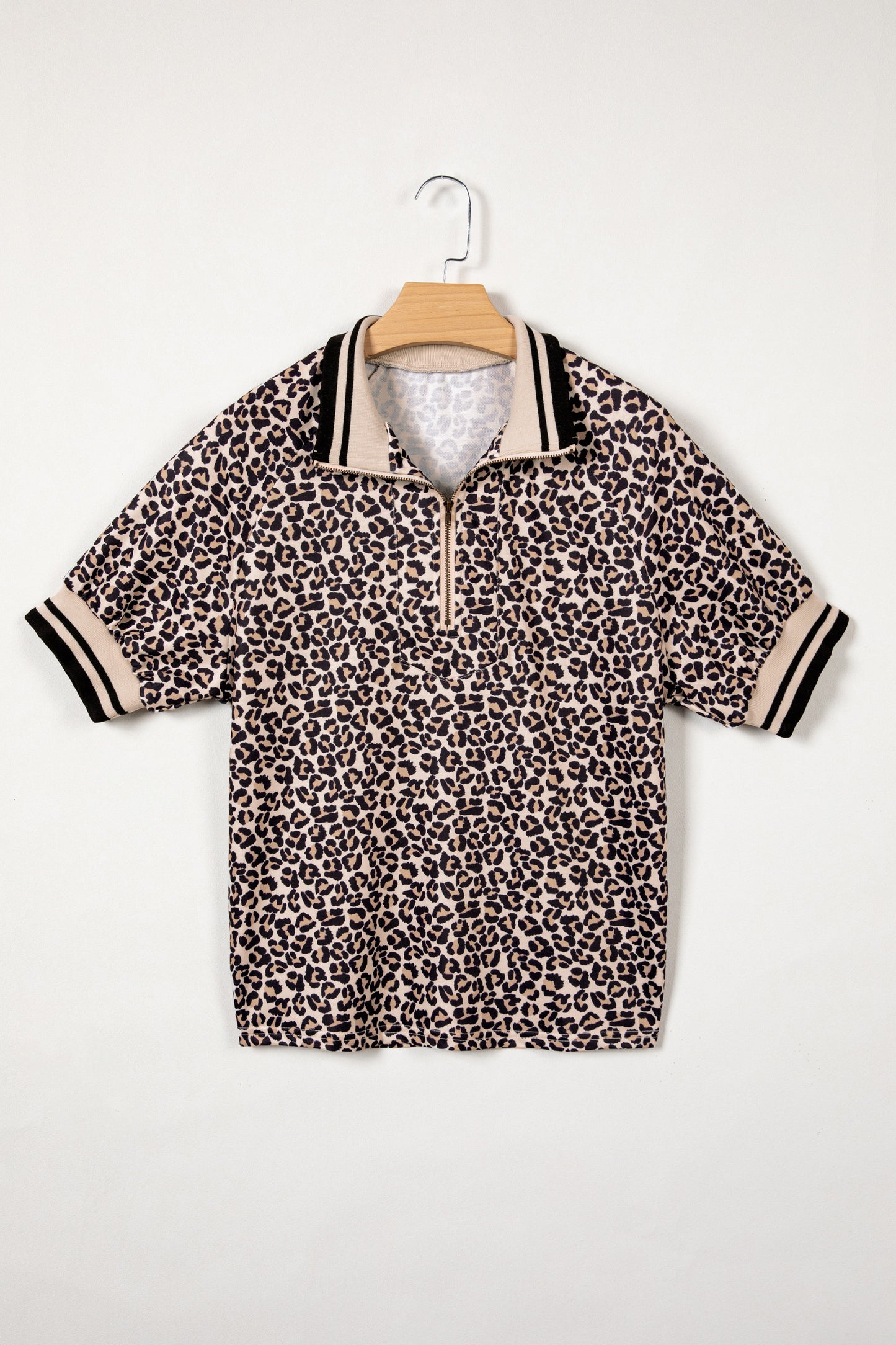 Modern Grace brown leopard print half-zip blouse with striped trim and patchwork short sleeves, stylish top for casual wear.