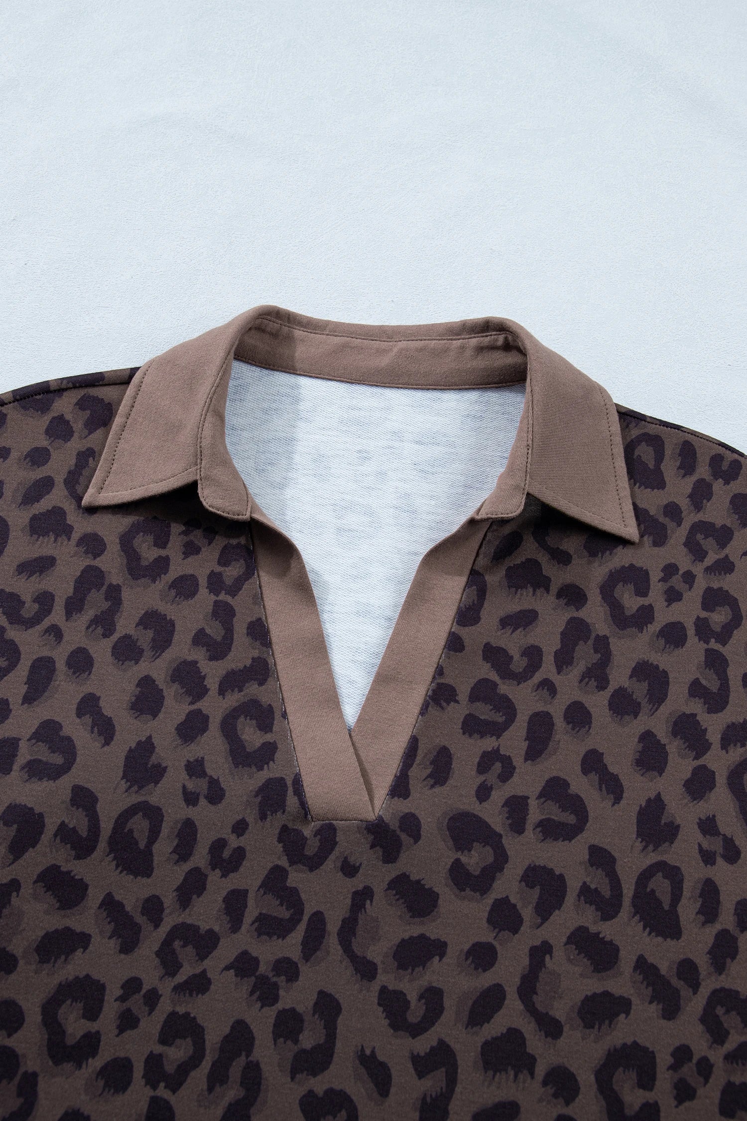 Brown leopard print V-neck high waist two-piece short set by Modern Grace, featuring a stylish crop top and matching shorts.
