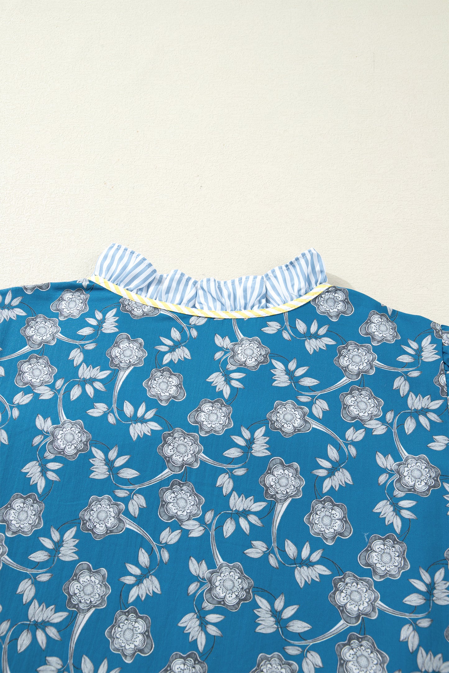 Blue plus size floral and striped patchwork mini dress by Modern Grace featuring button front and ruffle hem details.