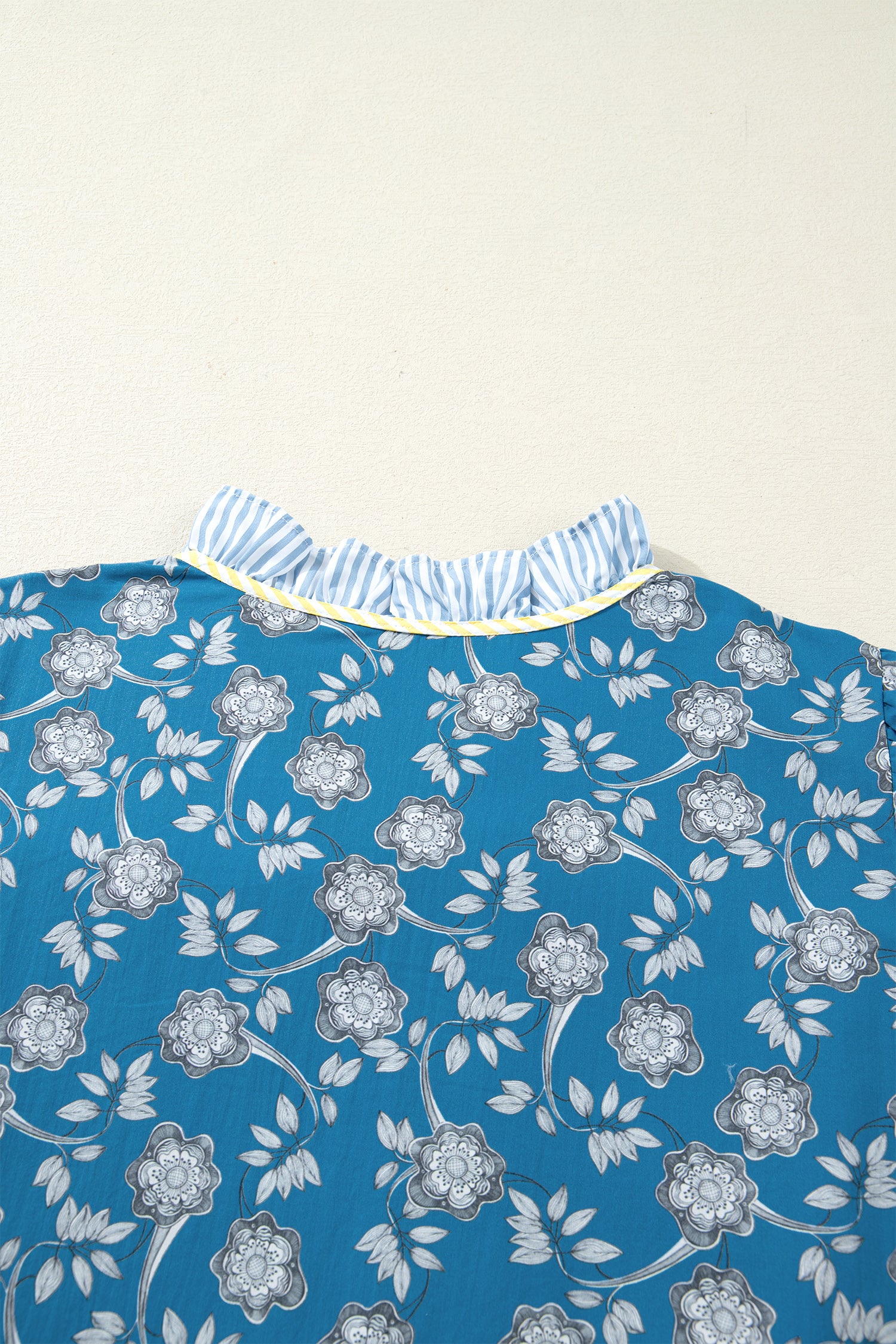 Blue plus size floral and striped patchwork mini dress by Modern Grace featuring button front and ruffle hem details.