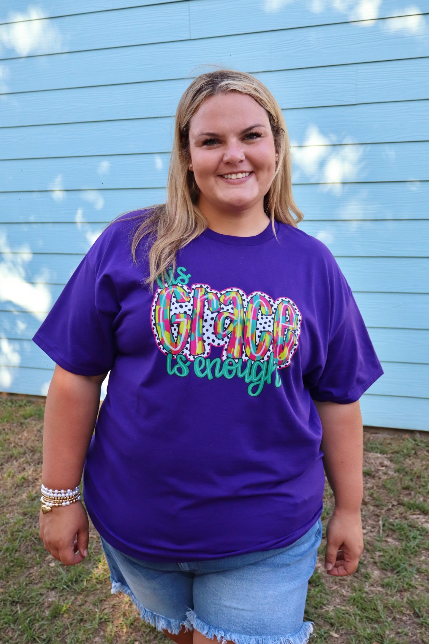 Purple Modern Grace "His Grace Is Enough" T-shirt with white text, casual fit, front view, soft fabric, and stylish design.