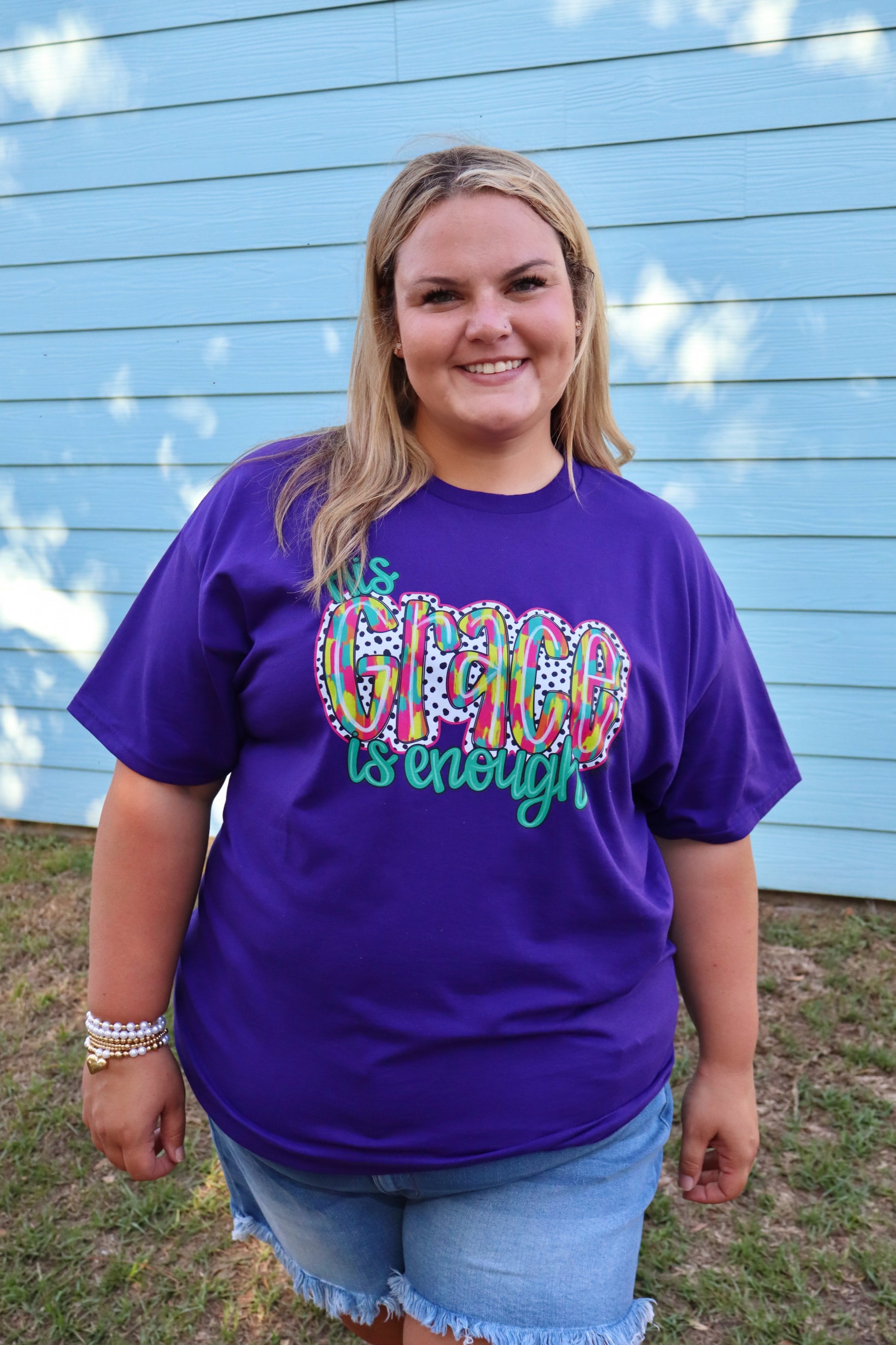 Purple Modern Grace "His Grace Is Enough" T-shirt with white text, casual fit, front view, soft fabric, and stylish design.