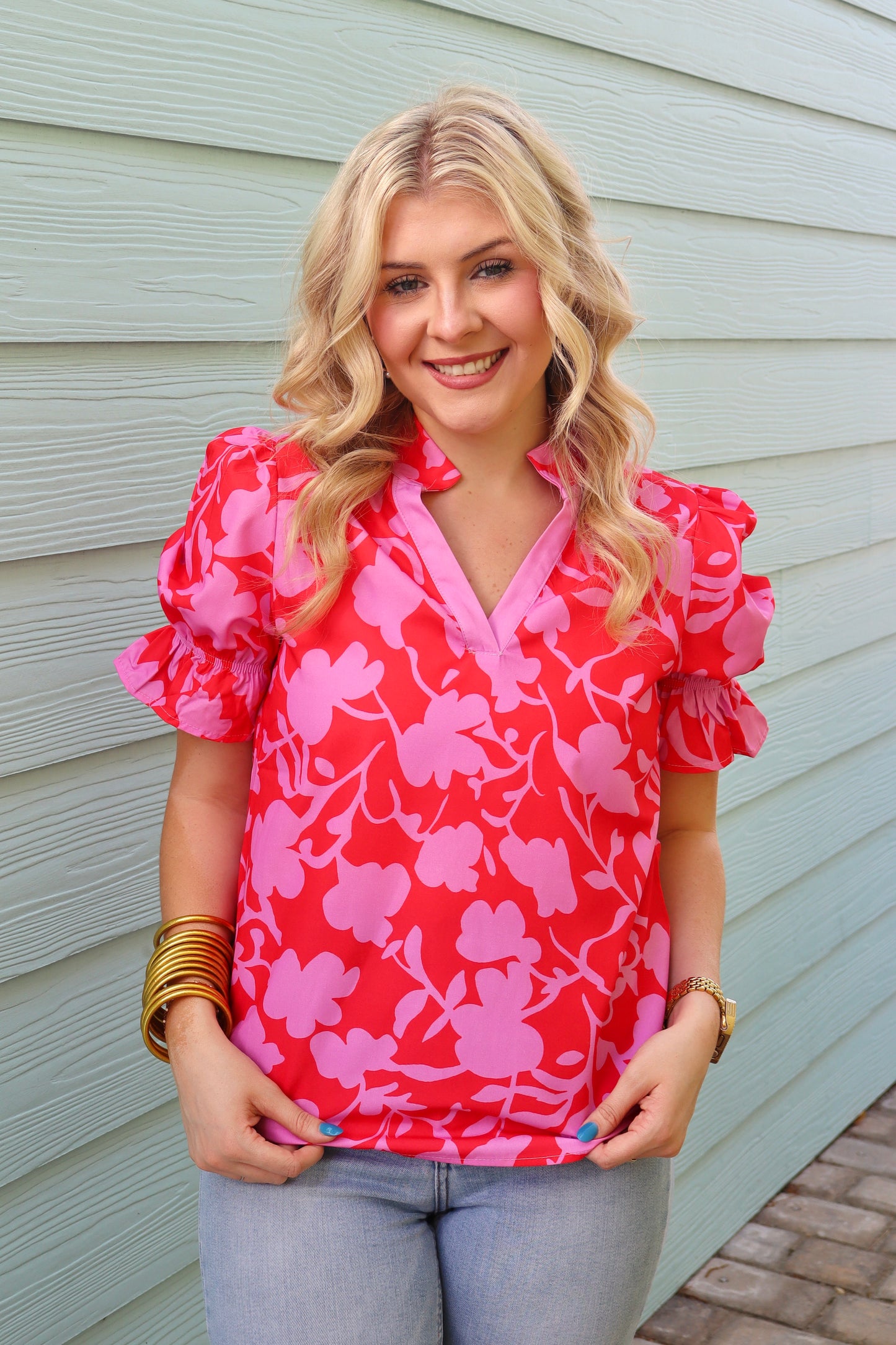 Red floral split V-neck ruffled short sleeve blouse by Modern Grace, featuring a stylish floral print and feminine ruffle details.