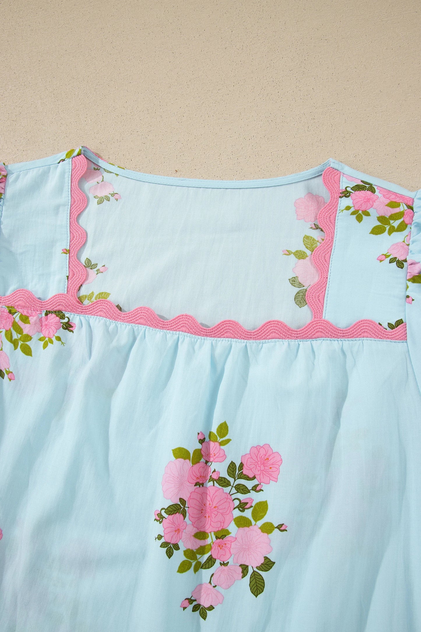 Sky blue floral ricrac trim square neck blouse with bubble sleeves, by Modern Grace, showcasing a stylish woven top with floral details.