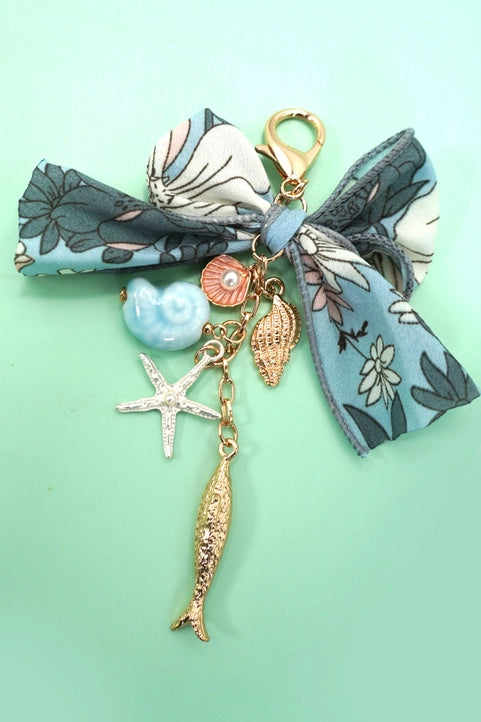 Ocean porcelain bag charm featuring fish, seashell, and starfish designs, by Modern Grace, perfect as a stylish accessories accent.