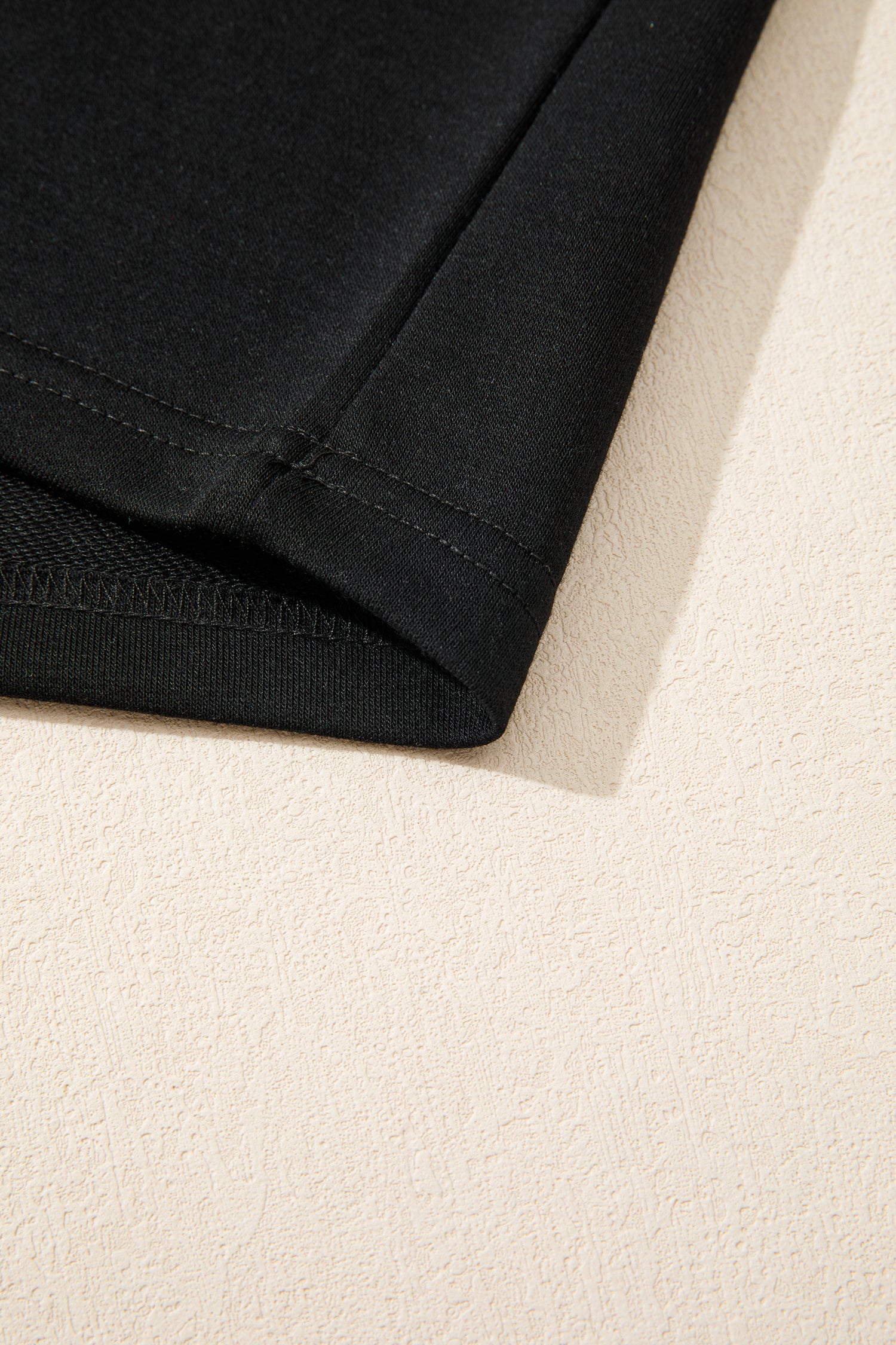 Modern Grace black leopard bow V-neck loose tee and drawstring shorts two-piece set, casual loungewear for women.