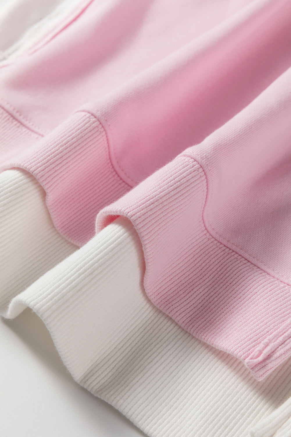 Plus size Modern Grace pink colorblock patchwork sweatshirt with a relaxed fit, featuring contrasting panels and cozy fabric.