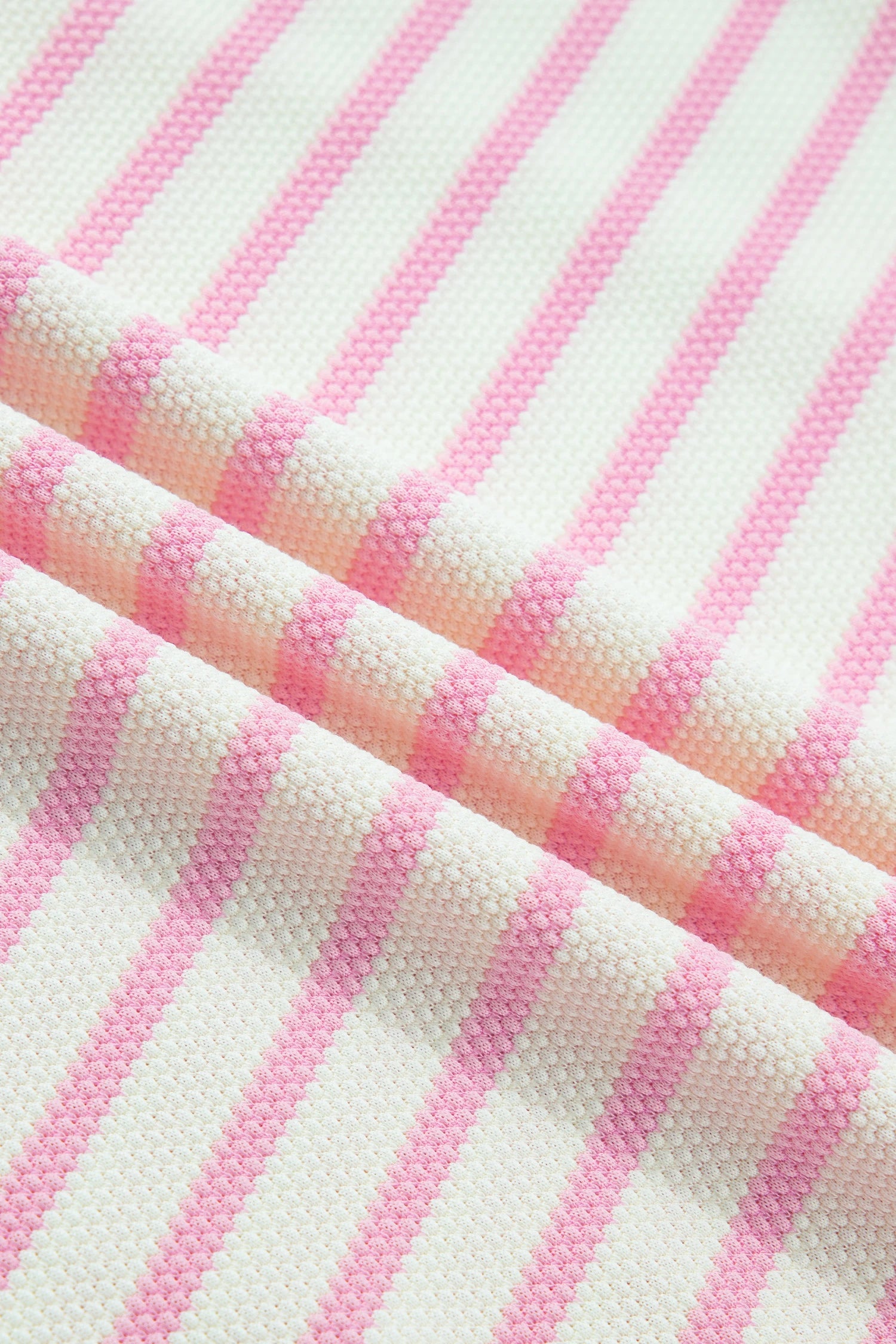 Pink stripe colorblock ruffle short sleeve patchwork blouse by Modern Grace, featuring vibrant patterns and feminine ruffle details.