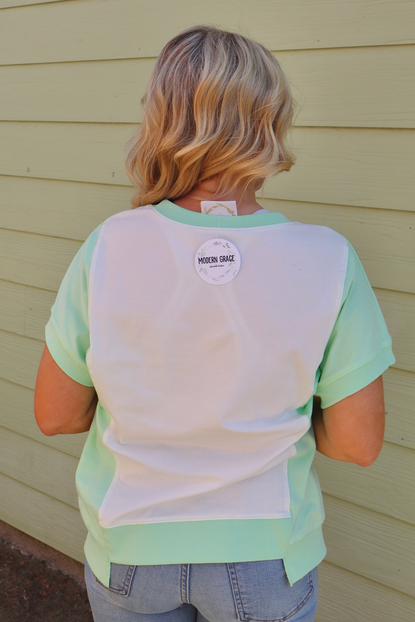 Light green color block crew neck T-shirt by Modern Grace with exposed seams and casual style.