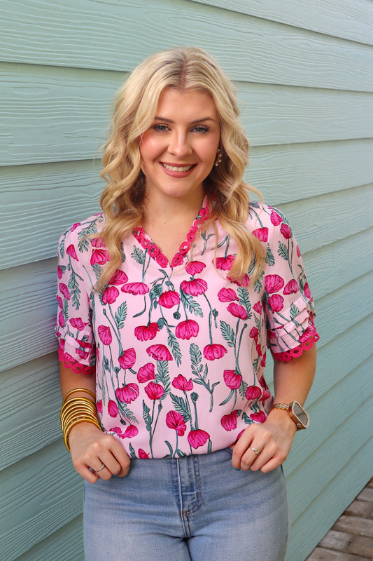Pink floral lace detail V-neck summer blouse by Modern Grace with frilled accents and feminine design.