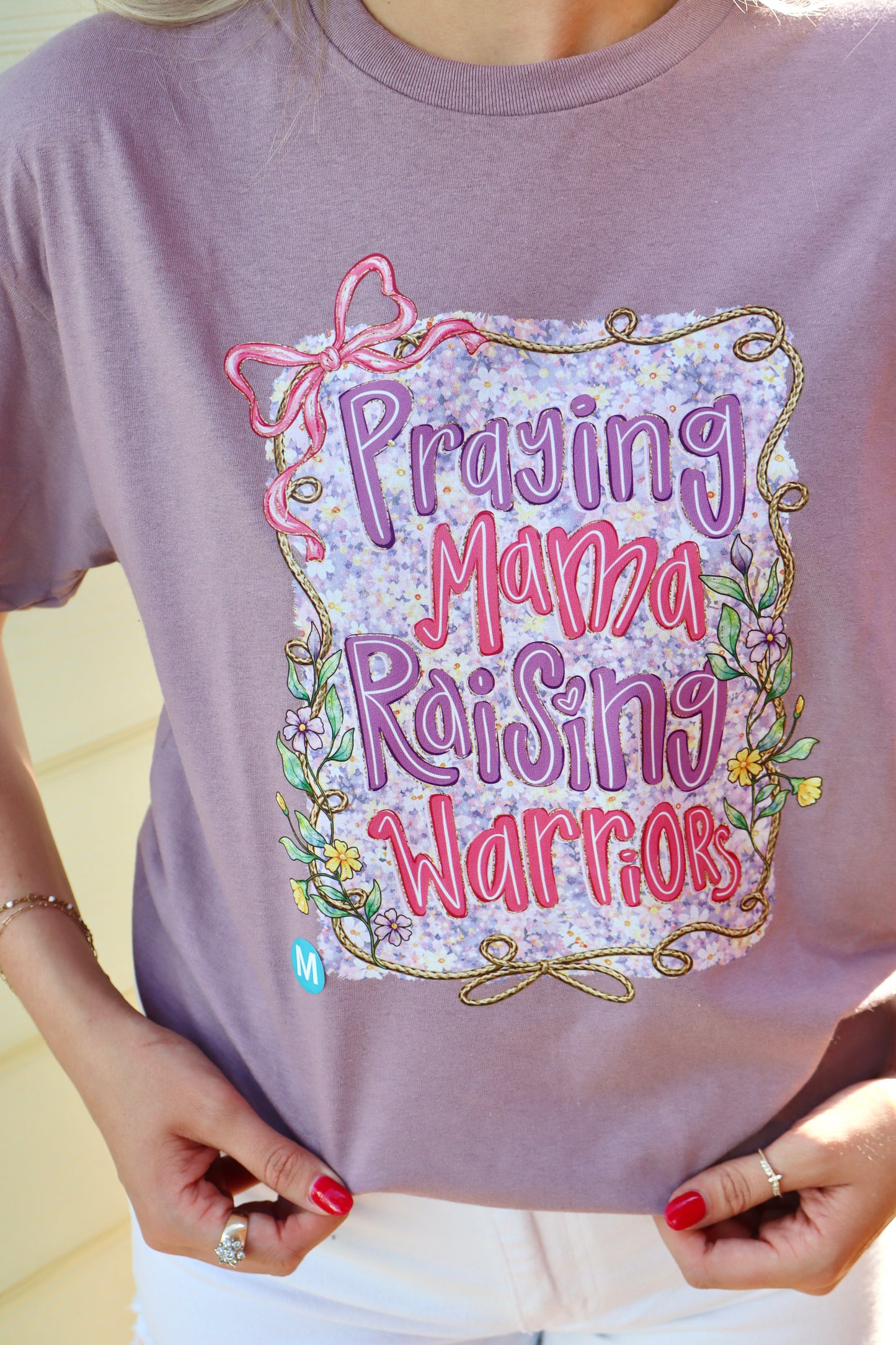 Modern Grace JTH "Praying Mama Raising Warriors" short sleeve T-shirt featuring a heartfelt design for moms and warriors.