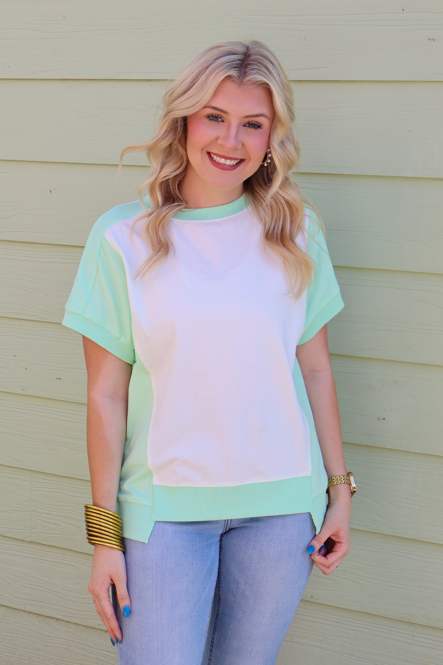Light green color block crew neck T-shirt by Modern Grace featuring exposed seam detailing and a casual, comfortable fit.