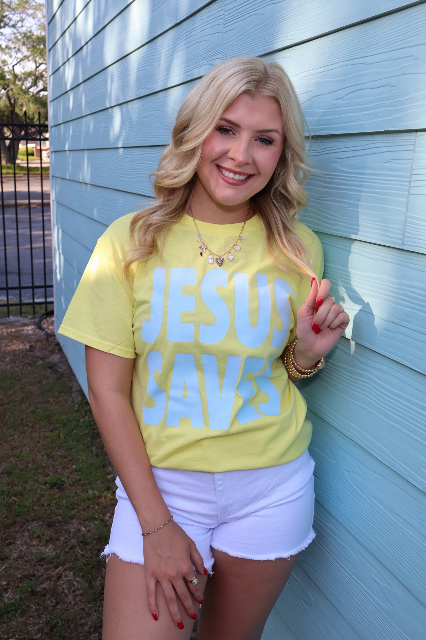 Modern Grace Jesus Saves short sleeve T-shirt with bold graphic design on white cotton fabric.