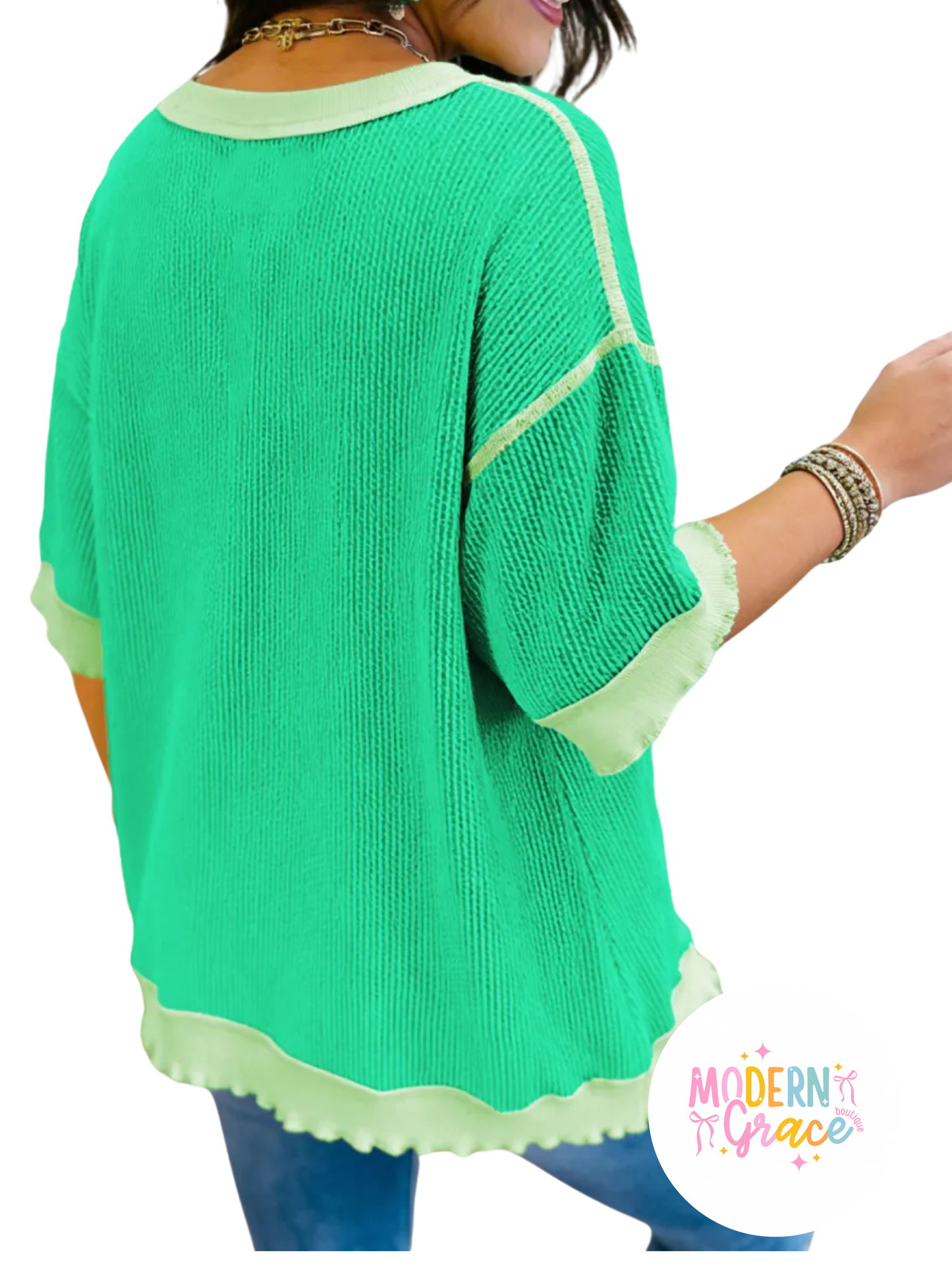 Mint green twisted rib knit tee with drop shoulder and uneven hem, styled as a modern Grace casual top.