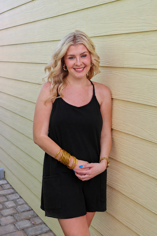 Black mini dress by Modern Grace featuring a built-in romper liner, shown on a model with a stylish, fitted design.