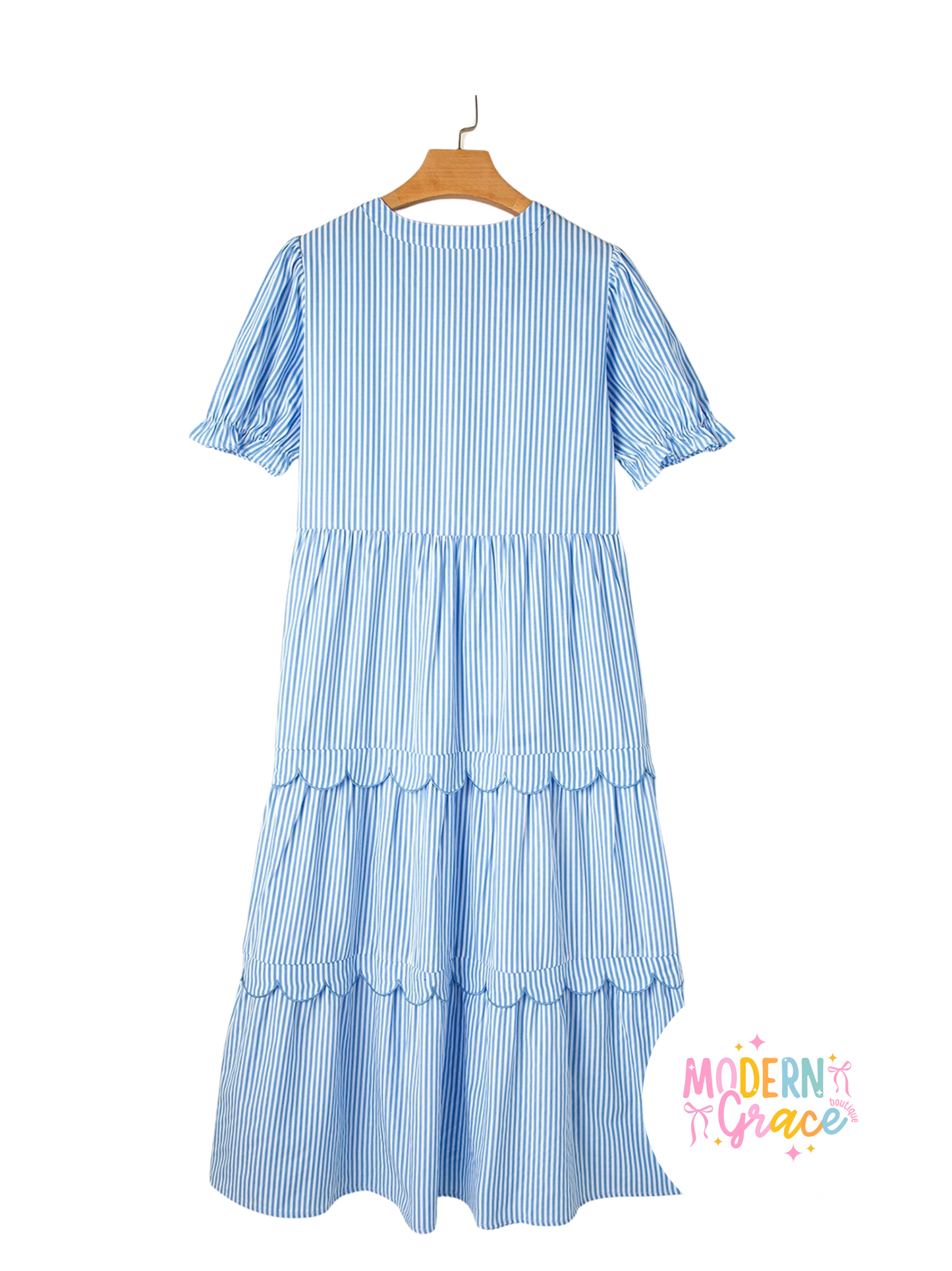 Sky blue striped tiered bubble short sleeve dress with scallop details by Modern Grace, showcasing its flowing fabric and stylish design.