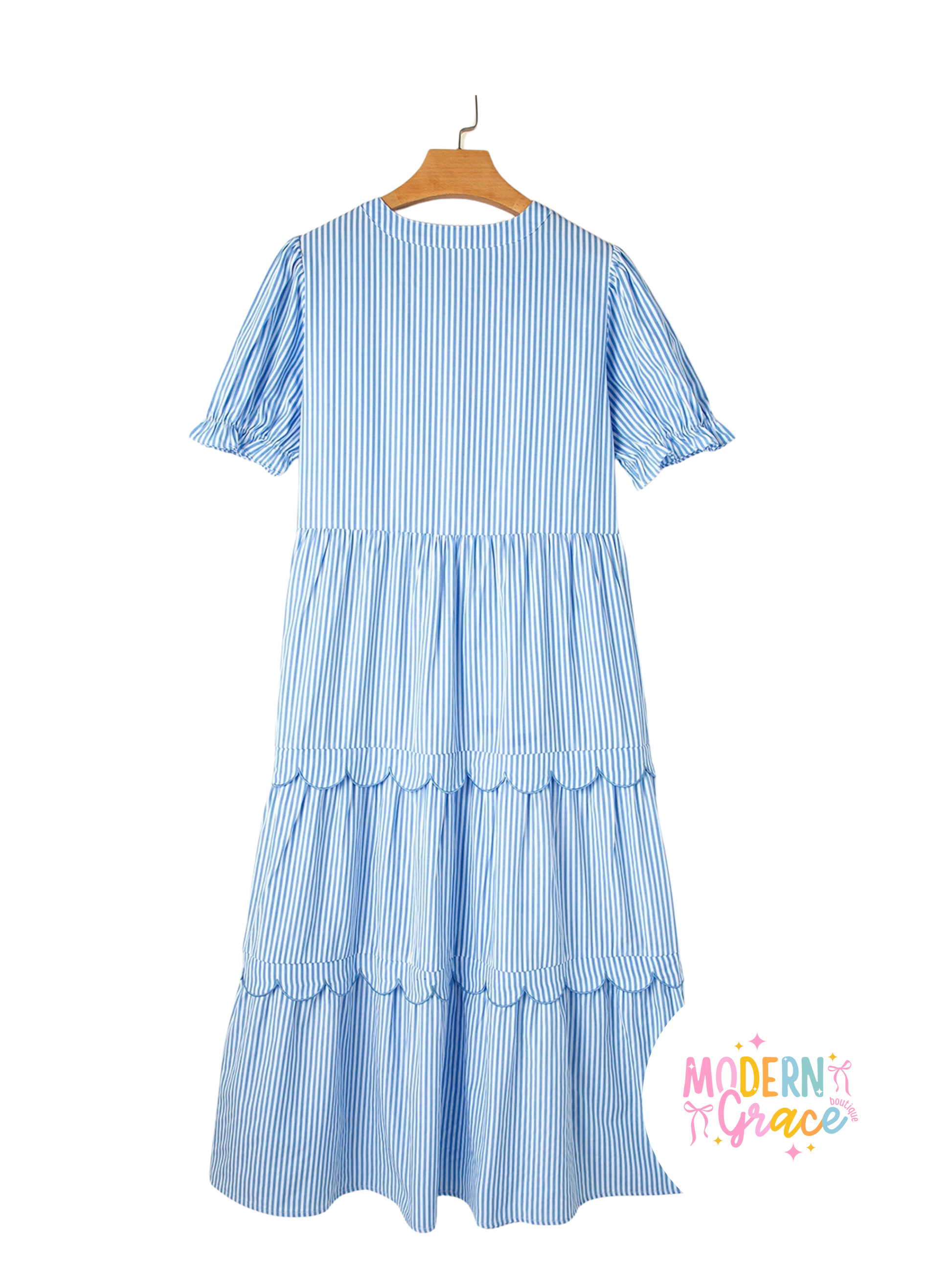 Sky blue striped tiered bubble short sleeve dress with scallop details by Modern Grace, showcasing its flowing fabric and stylish design.