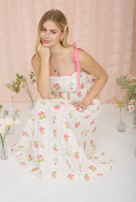 Pink floral tile pattern scalloped tie strap midi dress by Blu Pepper, featuring a feminine design and lightweight fabric.
